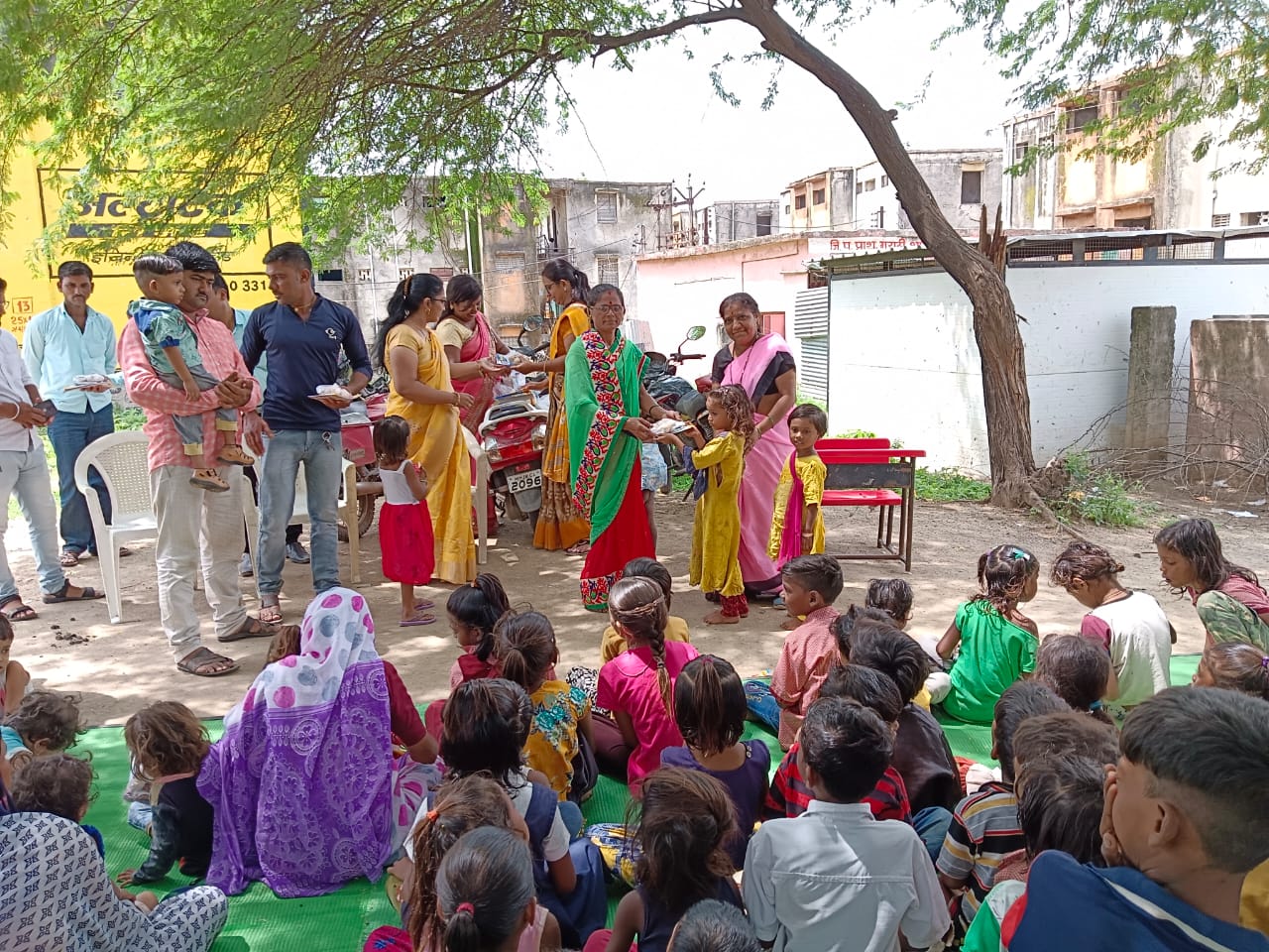 Khandesh Teli Samaj Mandal Distribution of food and school materials to children in Anganwadi center